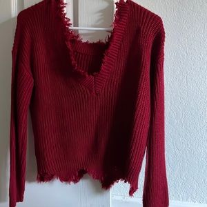 Distressed red sweater